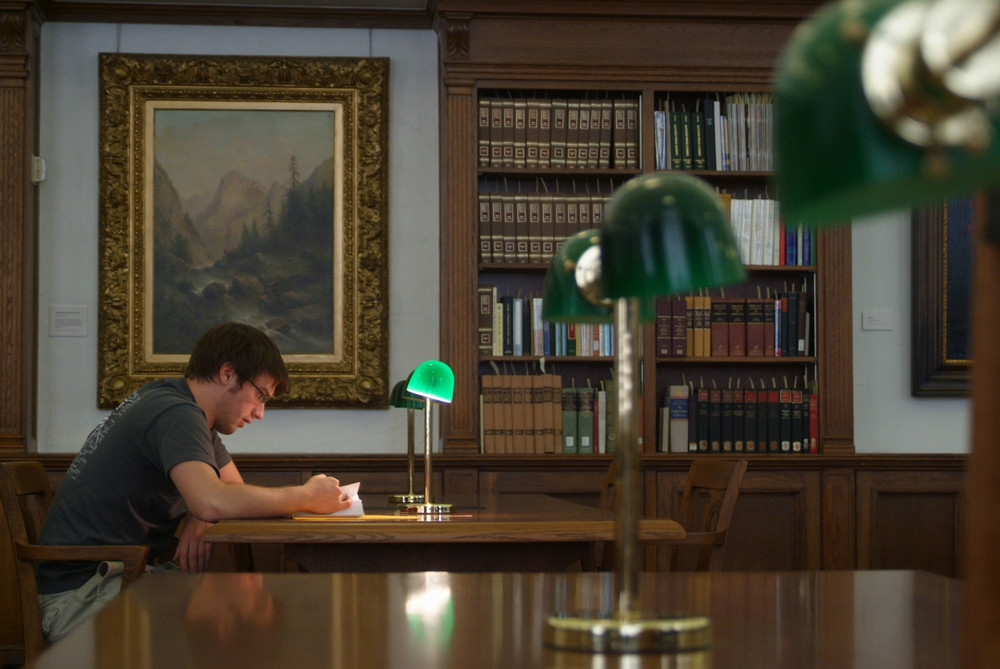 Student studying in Cushing Library